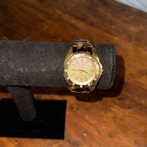 Anne Klein ladies tortoise shell wrist watch with gold accents